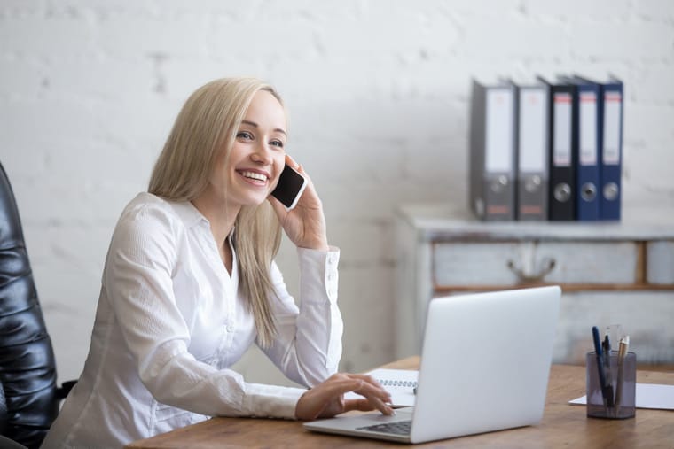 happy-businesswoman-working-her-office-2048x1365.jpg